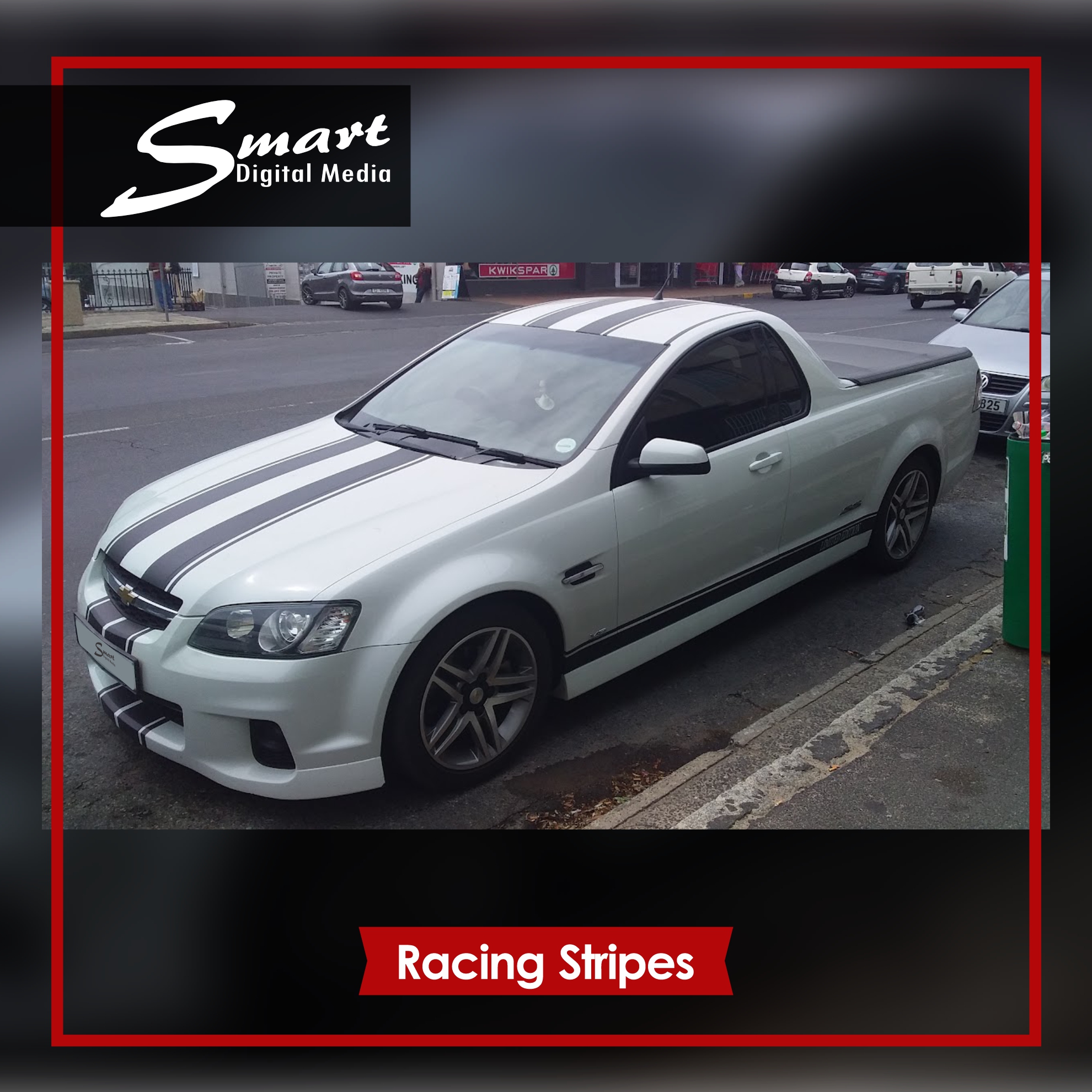Silver Chevrolet S.S with black racing stripes standing on side of road