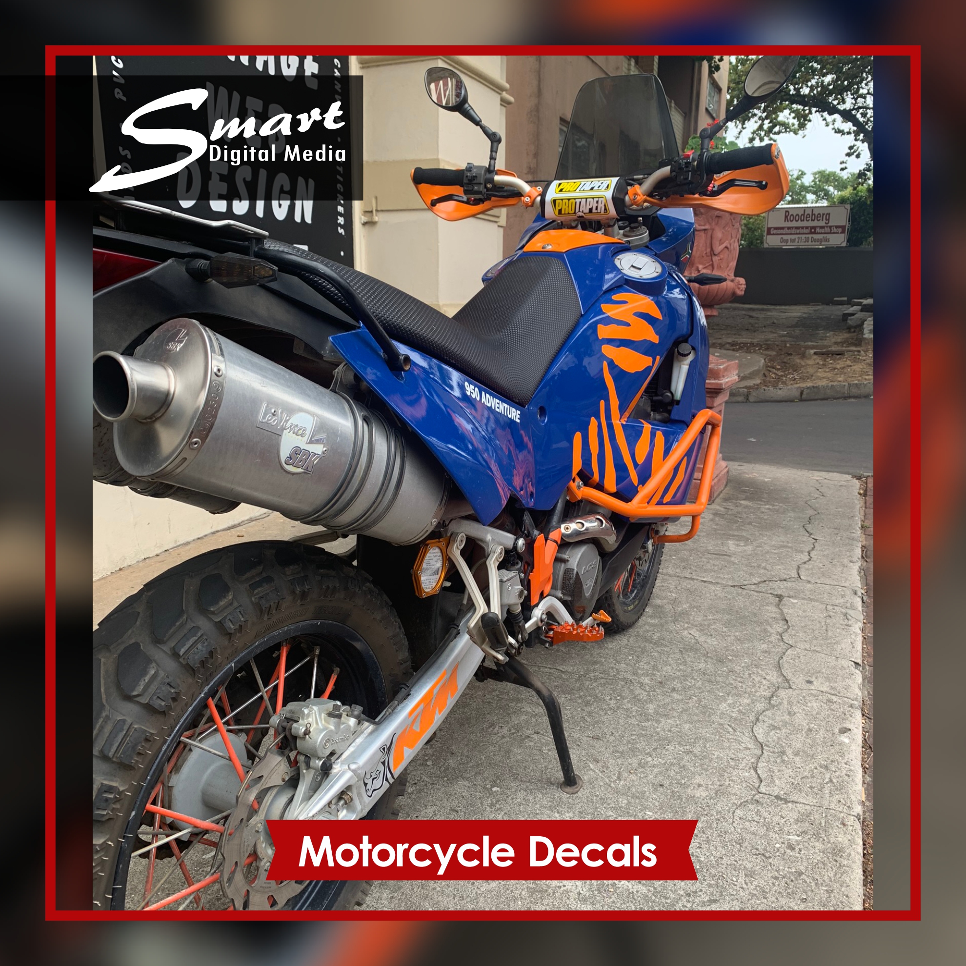 Blue KTM Motorcycle with orange DAKAR decals.