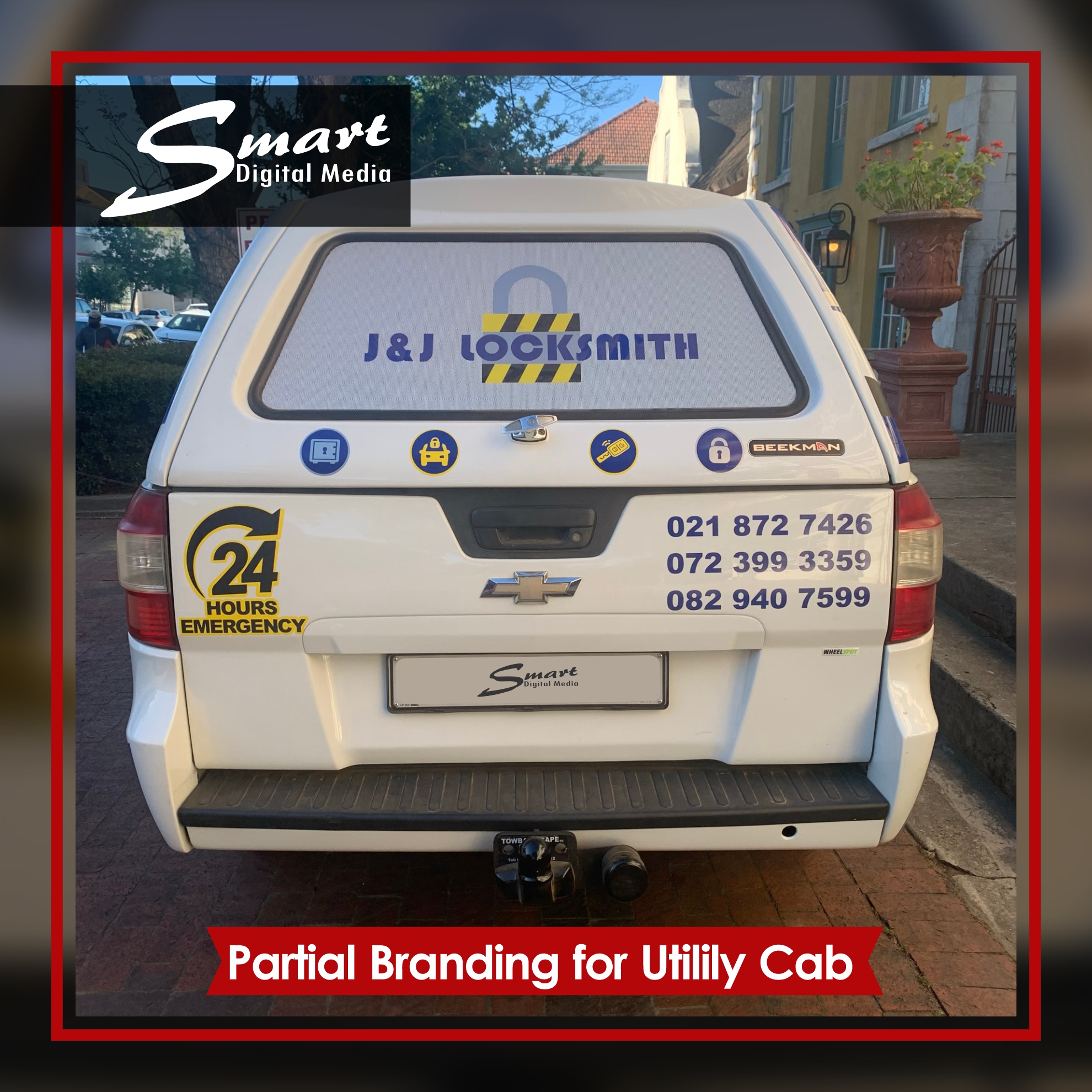 Chevrolet utility cab partially branded with J&J Locksmiths branding.
