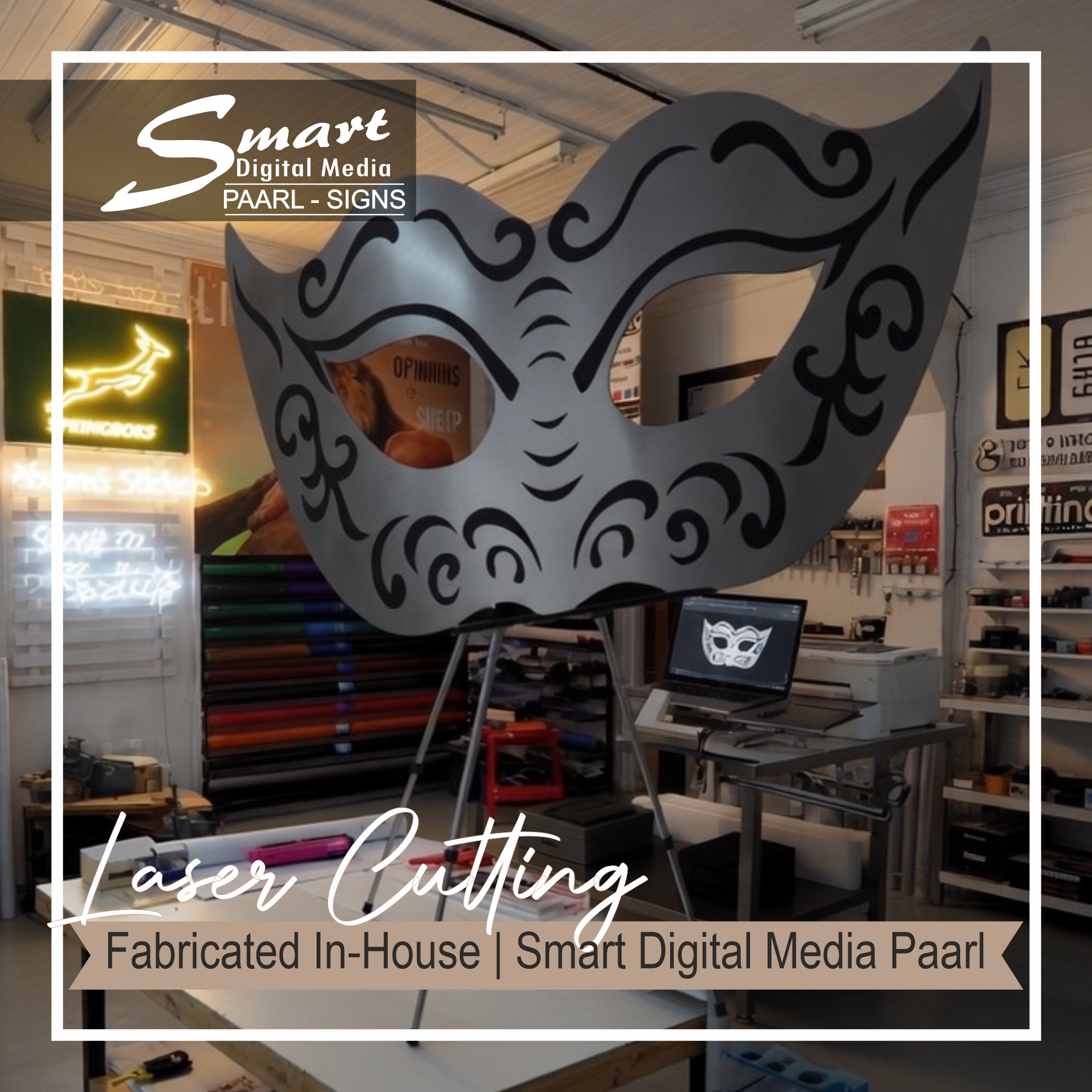 Large decorative laser-cut mask on display in Smart Digital Media’s Paarl signage Studio / Workshop, showcasing in-house fabrication capabilities