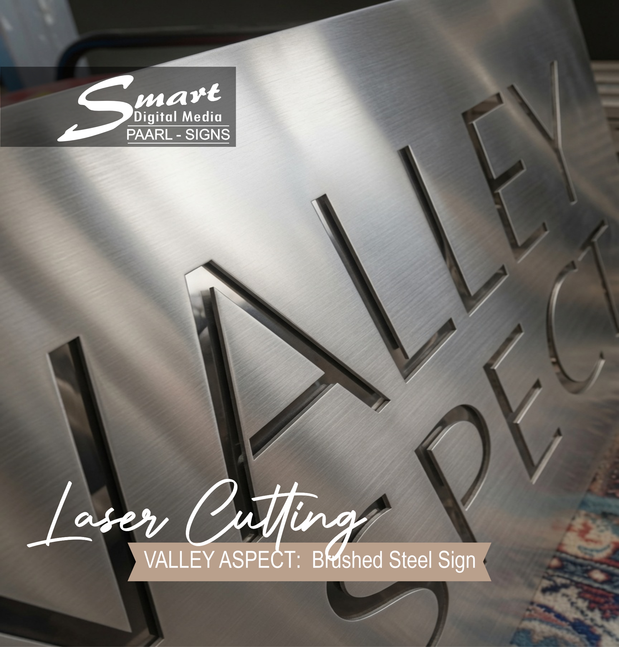Luxurious brushed stainless steel "VALLEY ASPECT" address sign mounted on marble wall. Custom home and street signage with elegant laser-cut lettering by Smart Digital Media Paarl – perfect for premium property branding.