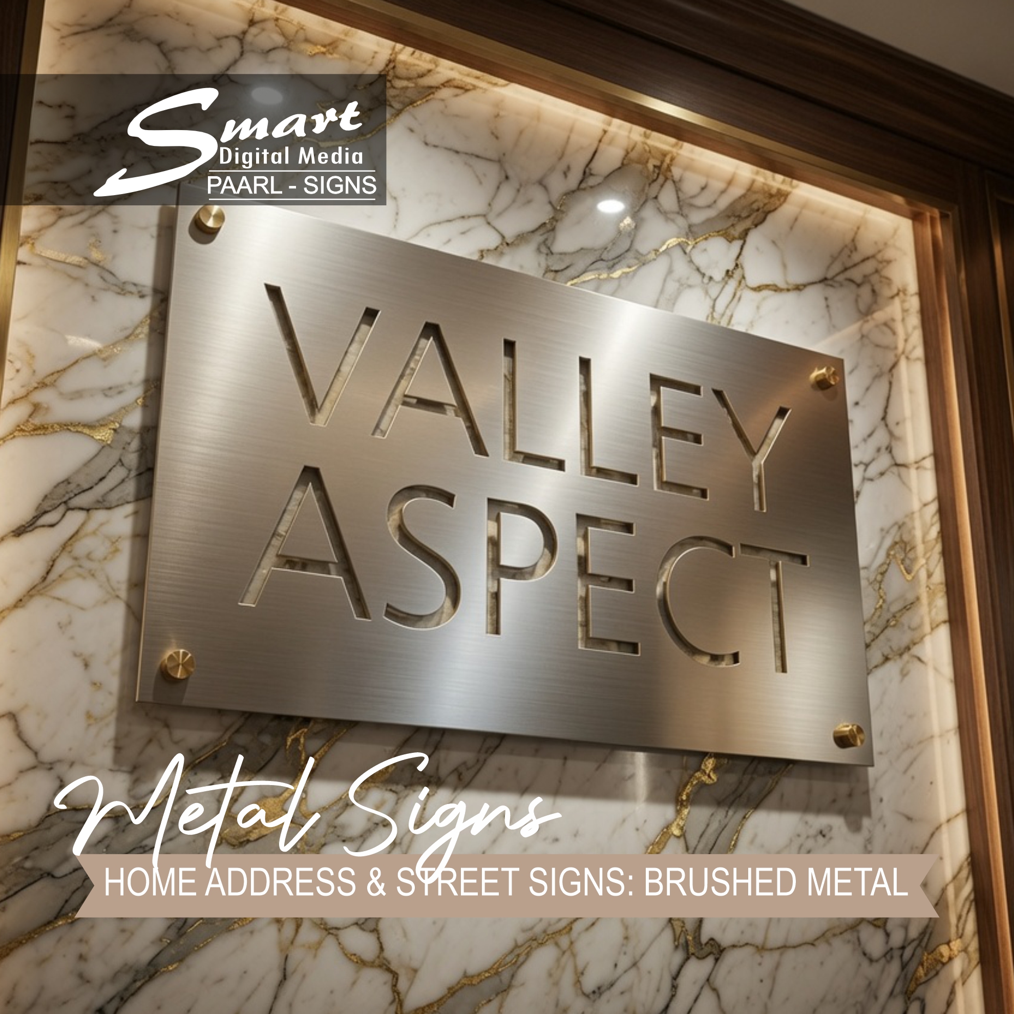High-end brushed metal signage "VALLEY ASPECT" is displayed on an elegant marble wall. Professional laser-cut stainless steel sign by Smart Digital Media Paarl, ideal for luxury home address signs and business wall plaques.